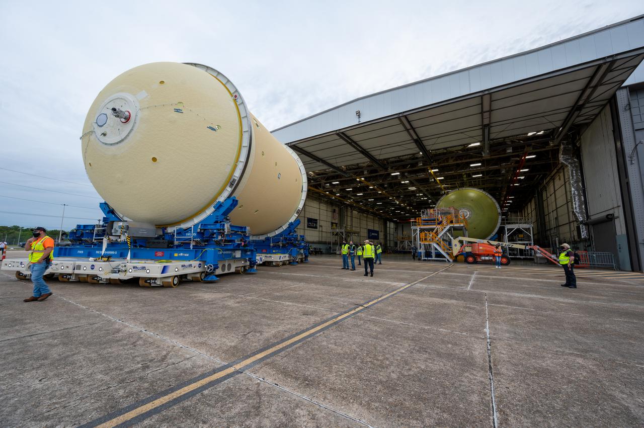 This image shows technicians and engineers moving the liquid oxygen tank (LOX) into position as they continue the process of the forward join on the core stage of NASA’s Space Launch System rocket for Artemis II, the first crewed mission of NASA’s Artemis program at NASA’s Michoud Assembly Facility. The forward join connects the forward skirt, the liquid oxygen tank (LOX) and the intertank structures to form the top part of the SLS rocket’s core stage. Now, NASA and Boeing, the SLS prime contractor, will continue to integrate various systems inside the forward part of the core stage and prepare for structural joining of the liquid hydrogen tank and engine section to form the bottom of the stage.  Together with its four RS-25 engines, the rocket’s massive 212-foot-tall core stage — the largest stage NASA has ever built — and its twin solid rocket boosters will produce 8.8 million pounds of thrust to send NASA’s Orion spacecraft, astronauts and supplies beyond Earth’s orbit to the Moon and, ultimately, Mars. Offering more payload mass, volume capability and energy to speed missions through space, the SLS rocket, along with NASA’s Gateway in lunar orbit, the Human Landing System, and Orion spacecraft, is part of NASA’s backbone for deep space exploration and the Artemis lunar program. No other rocket is capable of carrying astronauts in Orion around the Moon in a single mission. Image credit: NASA/Jared Lyons